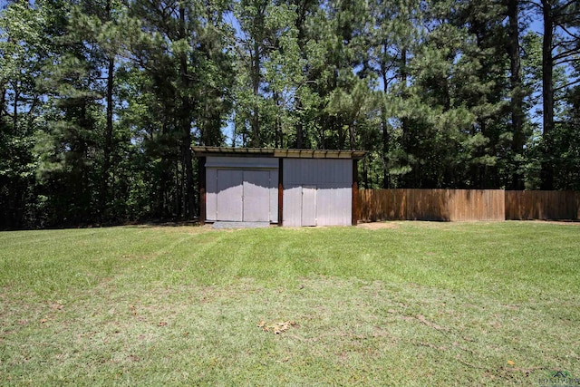 view of yard with a shed and an outdoor structure