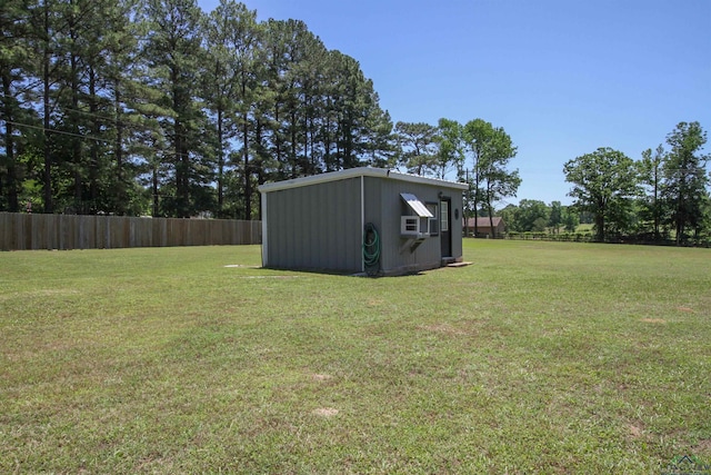 view of yard with a storage unit and an outbuilding
