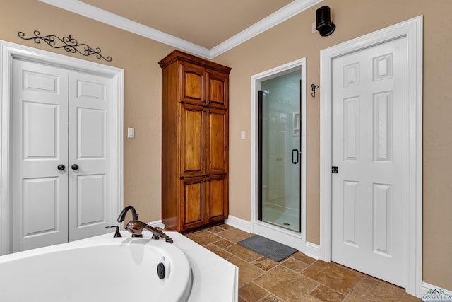 bathroom featuring crown molding and shower with separate bathtub