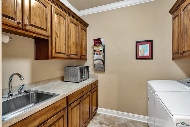 washroom with light tile patterned floors, independent washer and dryer, cabinets, ornamental molding, and sink