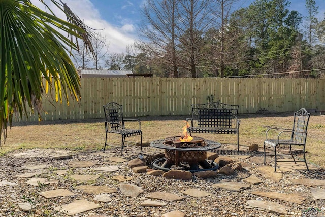 view of patio / terrace with an outdoor fire pit