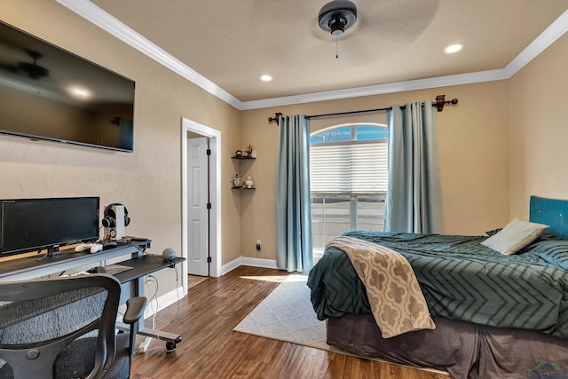 bedroom featuring ceiling fan, ornamental molding, and hardwood / wood-style flooring