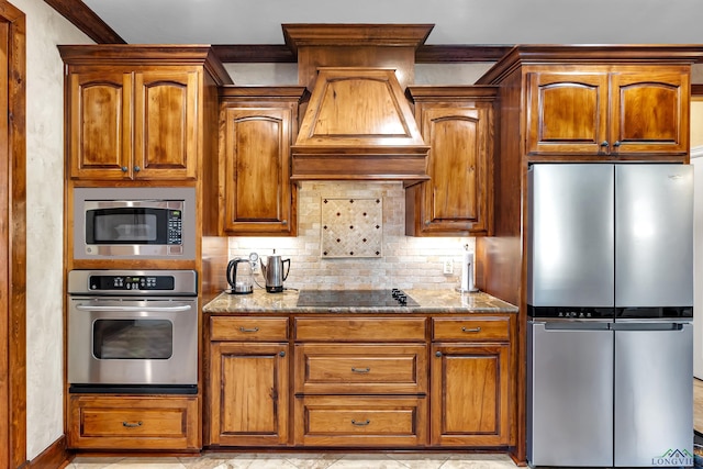 kitchen with stainless steel appliances, decorative backsplash, ornamental molding, and light stone counters