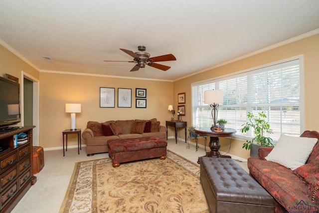 living room featuring light carpet, ceiling fan, and ornamental molding