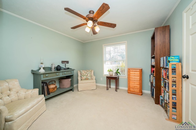 living area featuring light carpet, ceiling fan, and ornamental molding