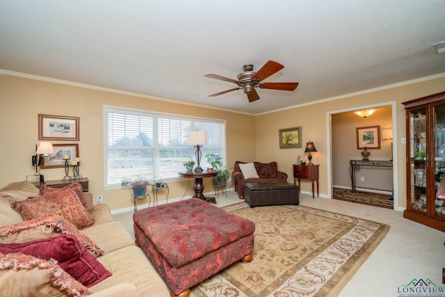 living room with carpet flooring, ceiling fan, and ornamental molding