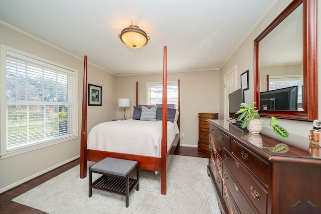 bedroom with light wood-type flooring and crown molding