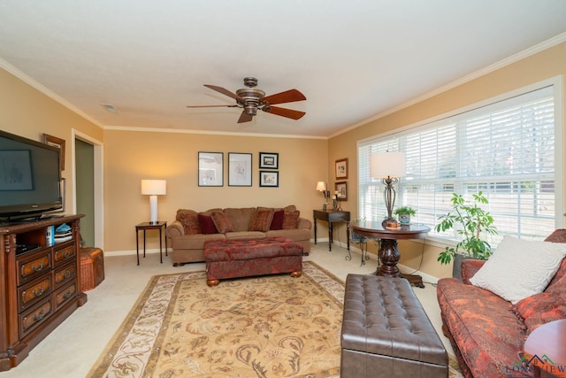 living room with carpet floors, ceiling fan, and crown molding