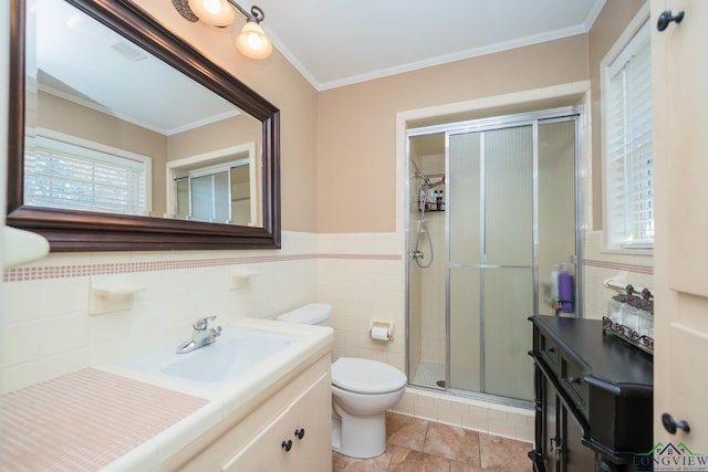 bathroom featuring vanity, toilet, ornamental molding, and walk in shower