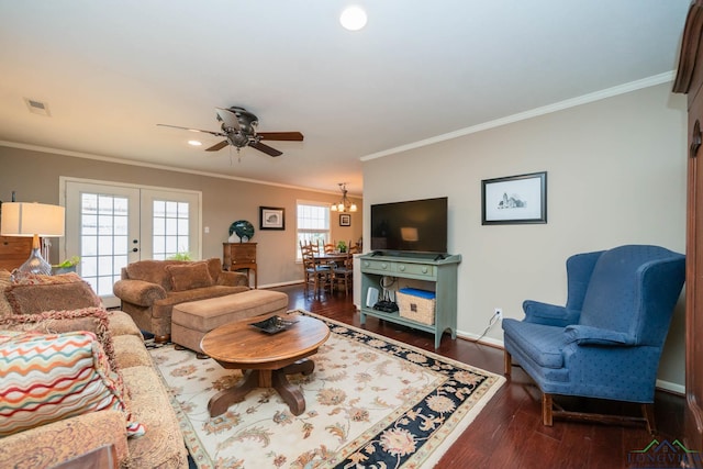 living room with french doors, dark hardwood / wood-style flooring, a wealth of natural light, and ornamental molding