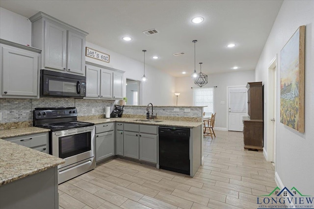 kitchen featuring a peninsula, visible vents, gray cabinetry, and black appliances