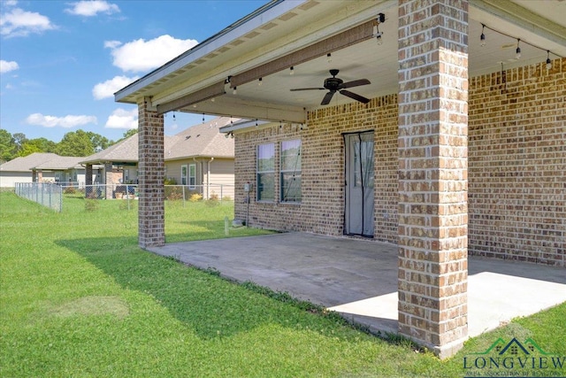view of patio / terrace featuring fence and a ceiling fan