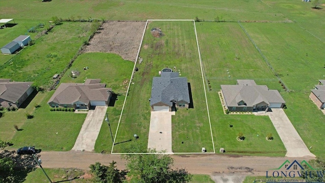 birds eye view of property featuring a rural view