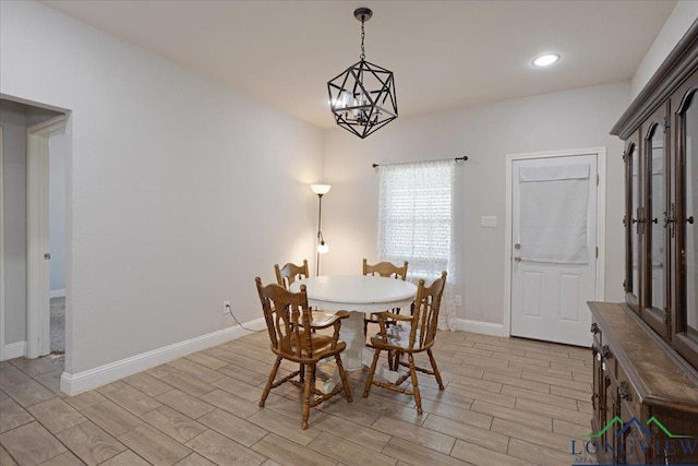 dining area featuring recessed lighting, light wood-style floors, and baseboards
