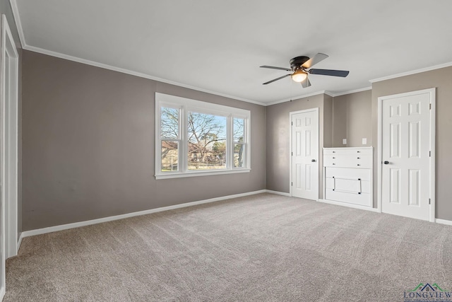 unfurnished bedroom with ceiling fan, carpet floors, and ornamental molding