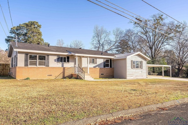 ranch-style house featuring a front lawn and a carport