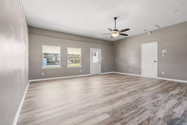 unfurnished room featuring ceiling fan and light hardwood / wood-style floors