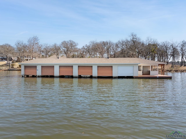 view of dock with a deck with water view