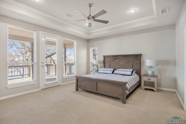 carpeted bedroom with a raised ceiling, ornamental molding, access to outside, and ceiling fan