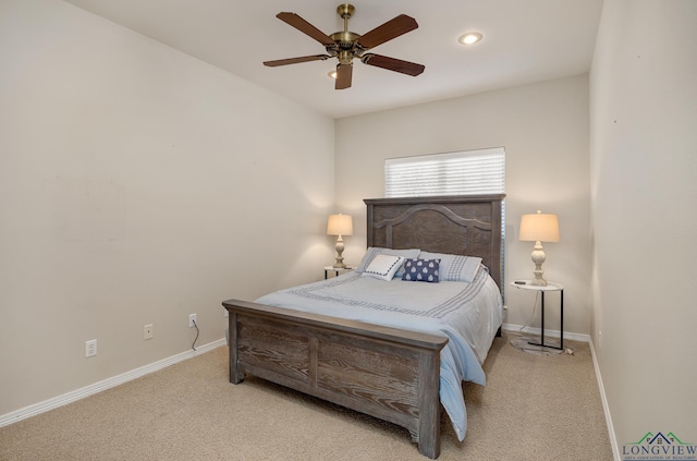 bedroom featuring light carpet and ceiling fan