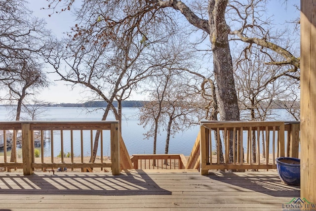 wooden deck with a water view