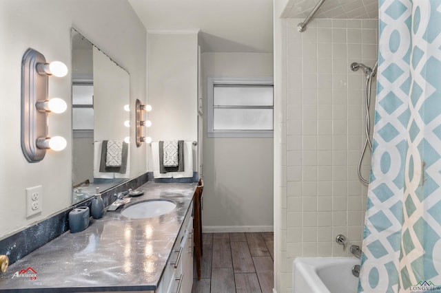 bathroom with vanity and tiled shower / bath combo