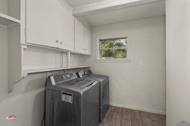 laundry room featuring cabinets and independent washer and dryer