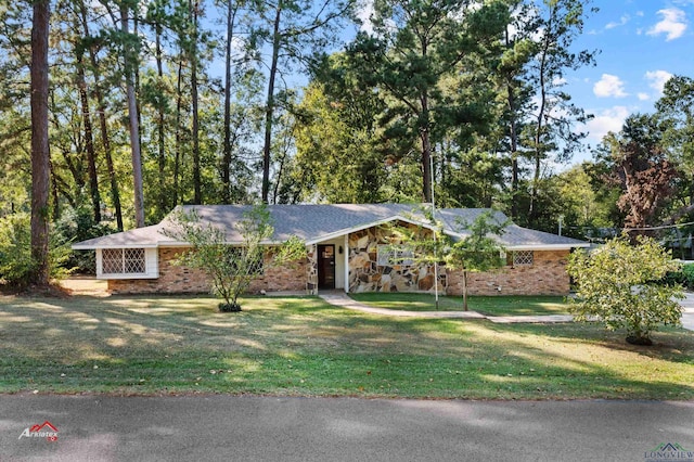 ranch-style home with a front yard