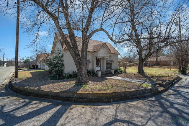 view of front of home with brick siding