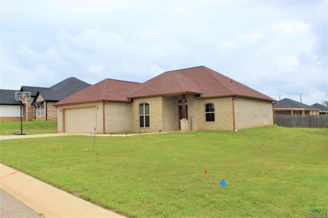 view of front of house with a front lawn and a garage