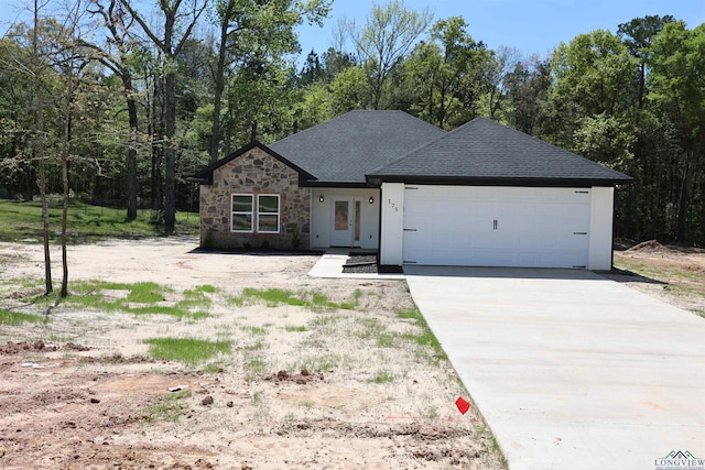 view of front of property with a garage