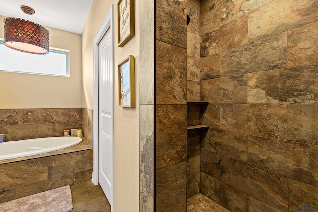 bathroom featuring shower with separate bathtub