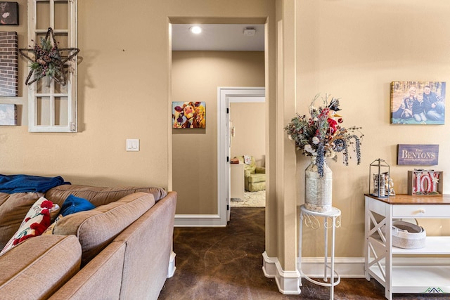 corridor with dark colored carpet