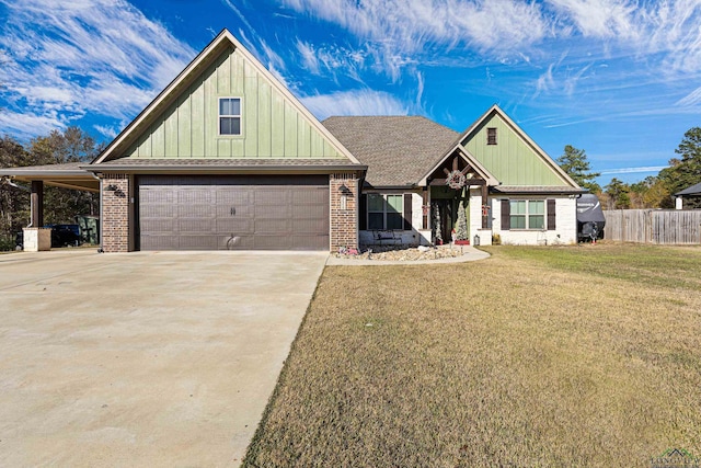 view of front of house featuring a garage and a front yard