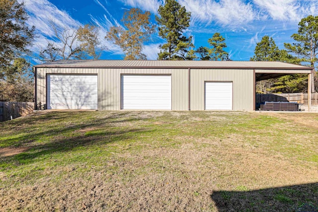 garage featuring a yard