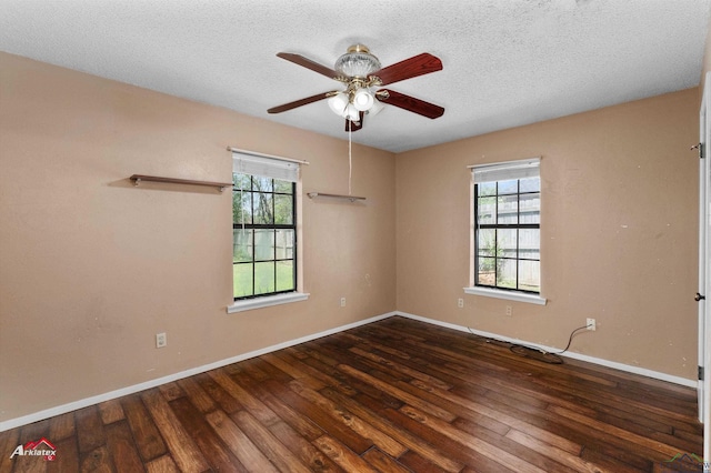 unfurnished room with baseboards, a textured ceiling, wood finished floors, and a ceiling fan