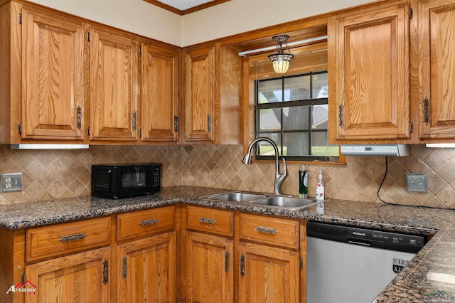 kitchen with brown cabinets, stainless steel dishwasher, a sink, black microwave, and backsplash