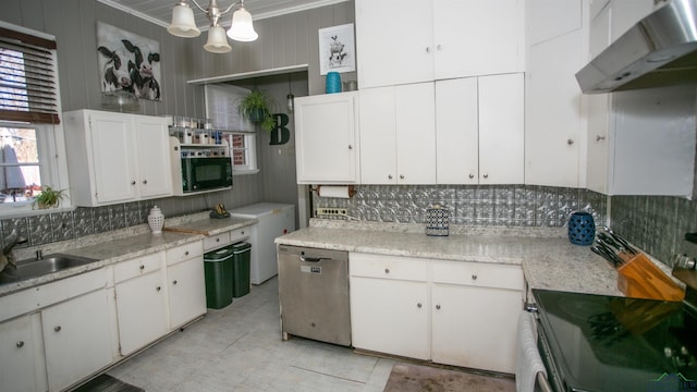 kitchen featuring sink, appliances with stainless steel finishes, white cabinets, and tasteful backsplash