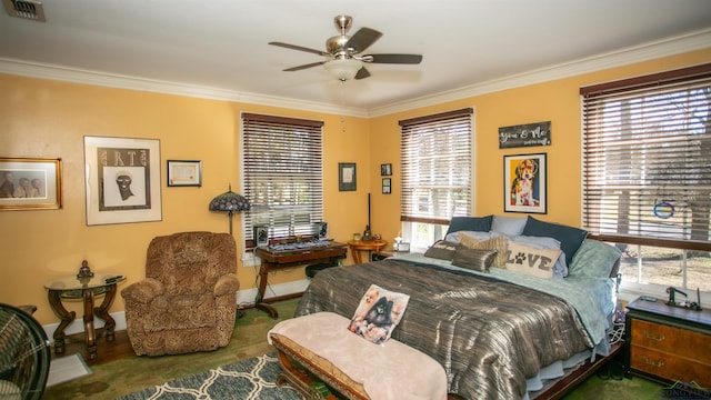 bedroom with ornamental molding and multiple windows