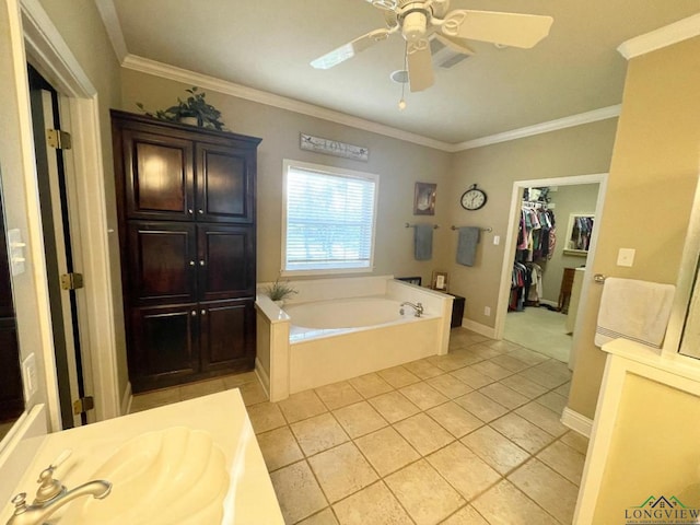 1928 Eastwood Dr, Henderson, TX 75652 - bathroom with a garden tub, tile patterned flooring, crown molding, a ceiling fan, and baseboards