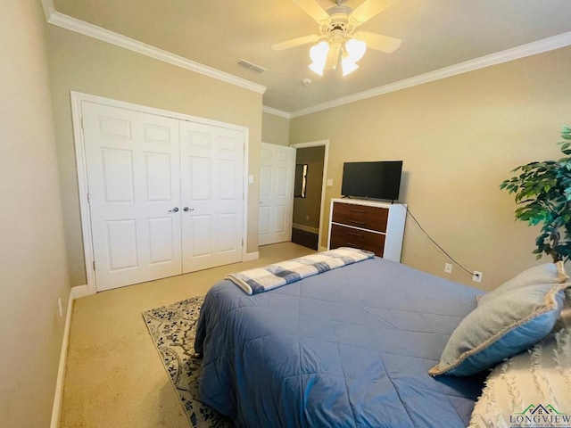 1928 Eastwood Dr, Henderson, TX 75652 - bedroom with ornamental molding, baseboards, carpet, a closet, and a ceiling fan