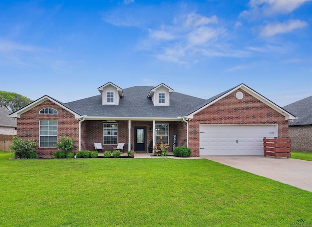 view of front facade featuring a garage, concrete driveway, brick siding, and a front yard