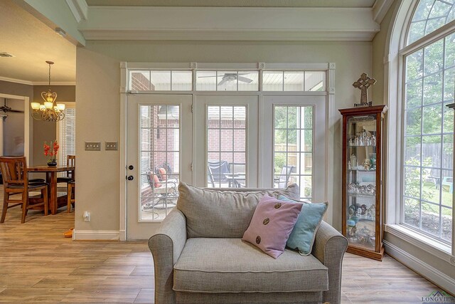 36 Briarwood Cir, Texarkana, TX 75503 - sitting room with plenty of natural light, a chandelier, baseboards, light wood finished floors, and crown molding