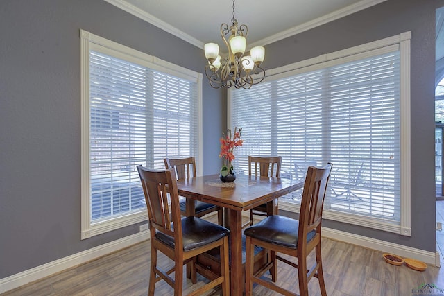 36 Briarwood Cir, Texarkana, TX 75503 - dining area with baseboards, a chandelier, ornamental molding, and healthy amount of natural light
