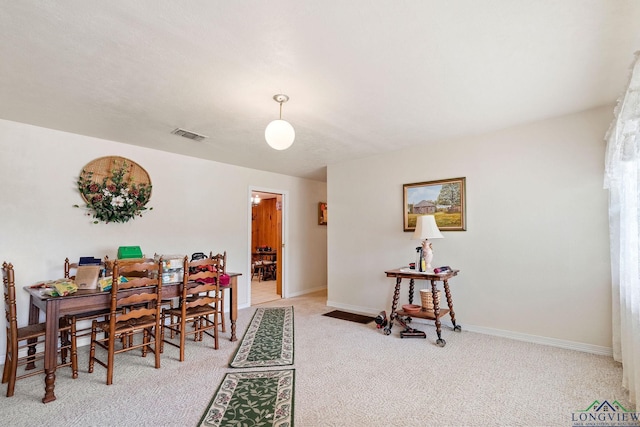 dining area with light carpet