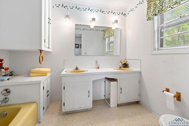 bathroom featuring a tub and vanity