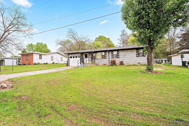 ranch-style home featuring a garage and a front yard