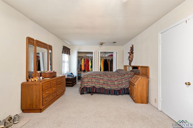 bedroom with light colored carpet