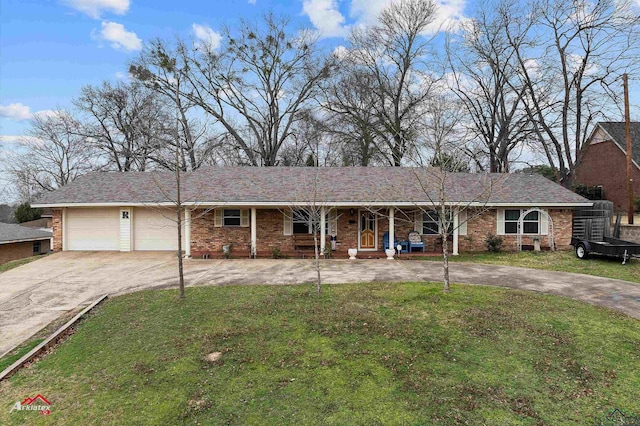 single story home featuring a garage and a front lawn