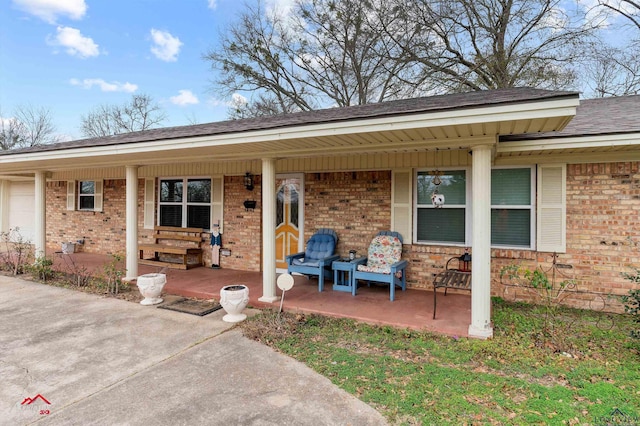 entrance to property featuring a porch